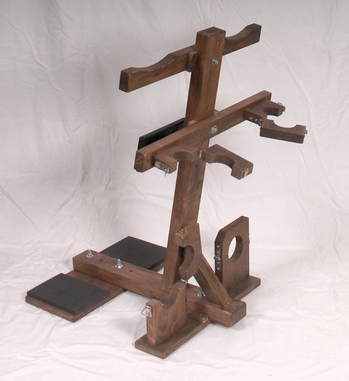 Kneeling bondage bench with wrist and ankle restraints, ideal for BDSM play.