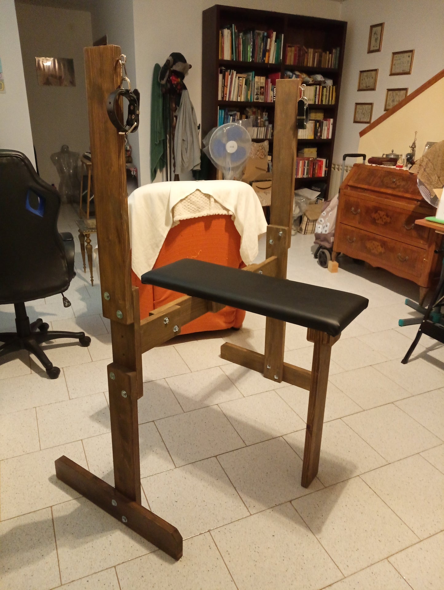 Sturdy wooden breeding bench in walnut finish for BDSM dungeon use