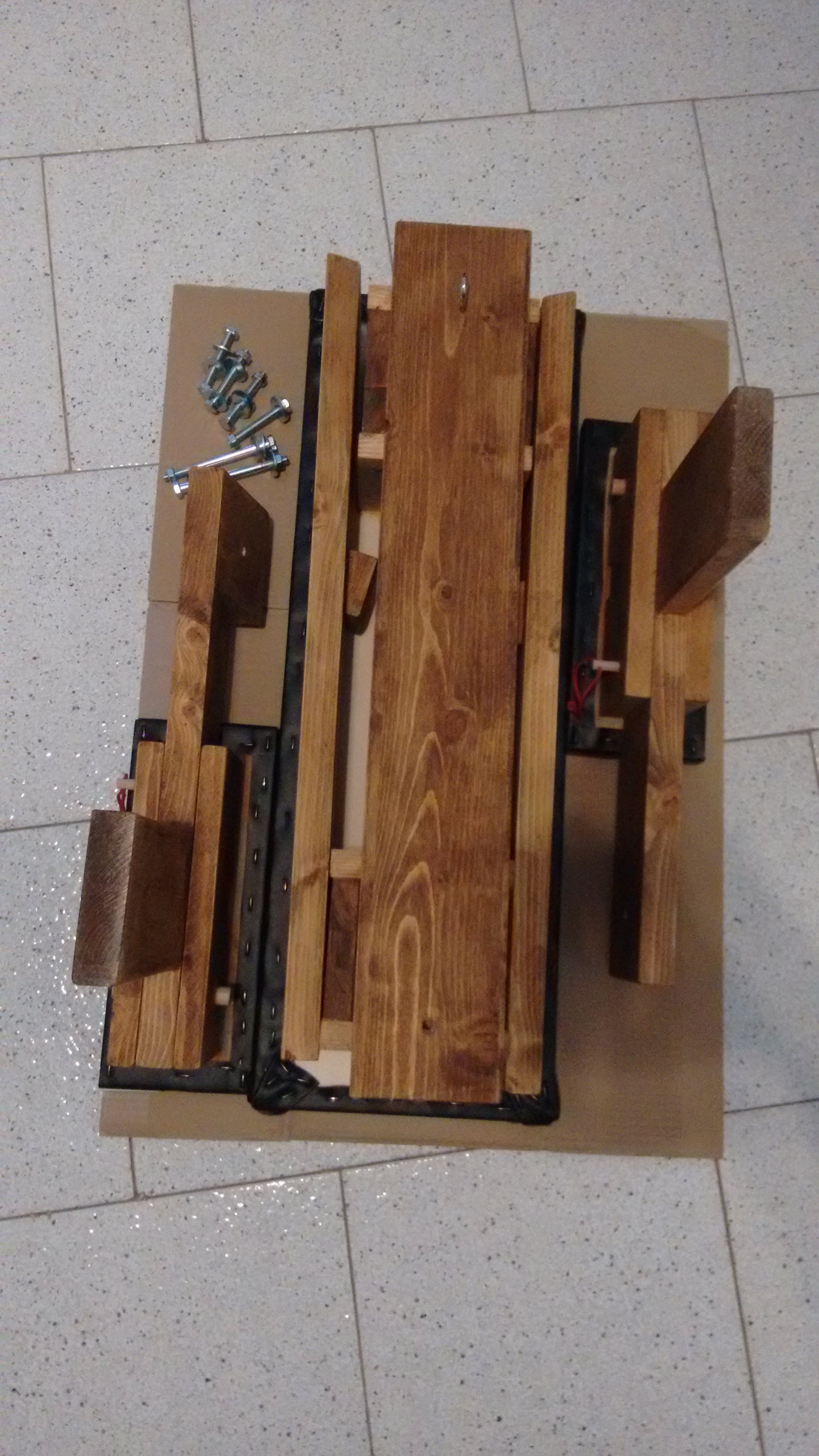 Spanking bench fully disassembled, showing easy storage and portability