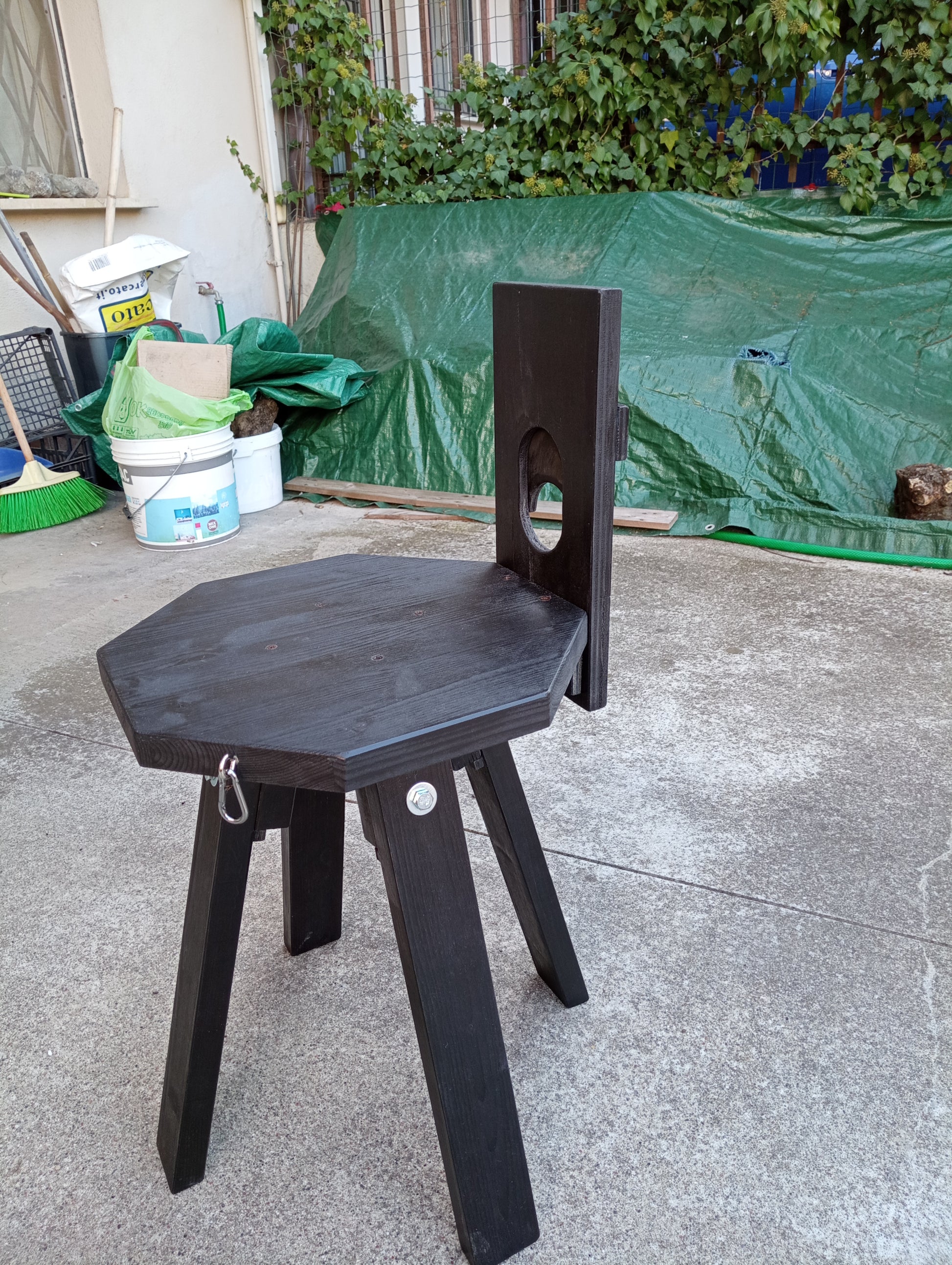 Side view of demountable CBT chair in matte black finish