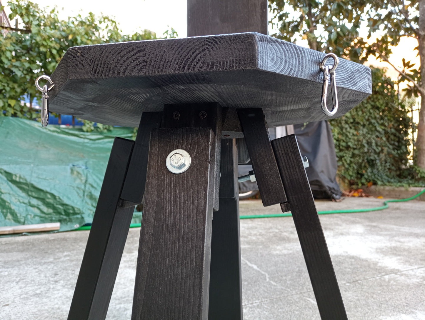 Close-up of hook rings and snap links on the Octagon bondage chair