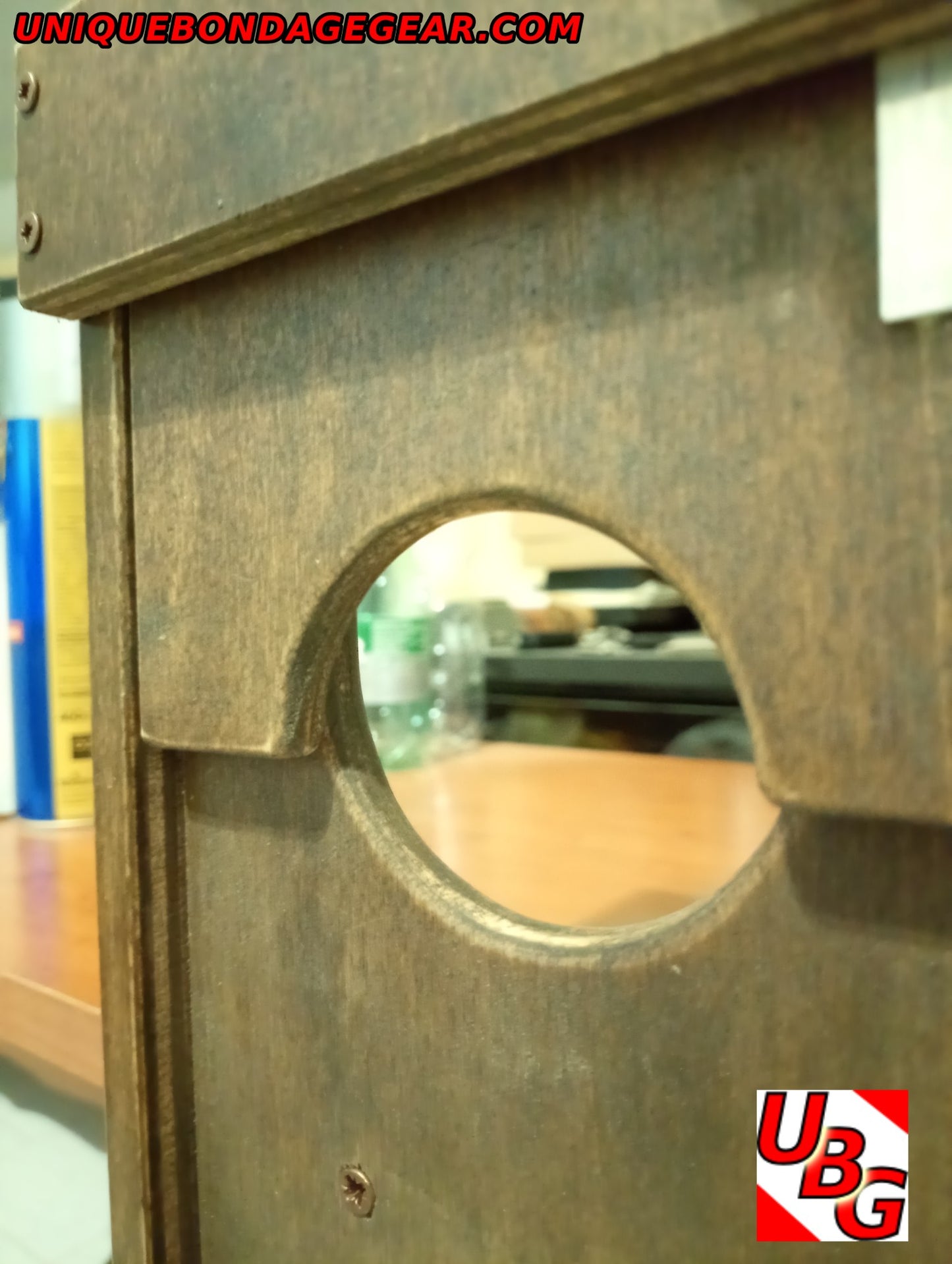 Close-up of compact CBT device for BDSM restraint – clamps easily to benches or tables with fast-lock system