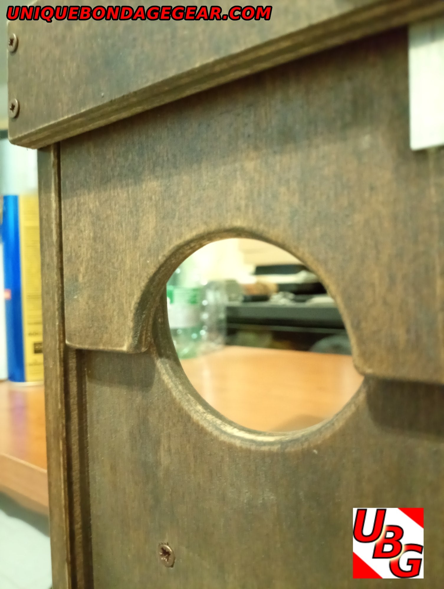 Close-up of compact CBT device for BDSM restraint – clamps easily to benches or tables with fast-lock system